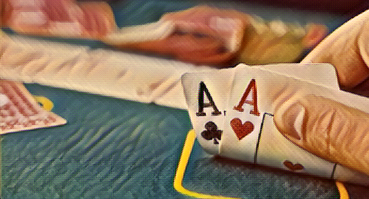 Poker table with pocket aces showing